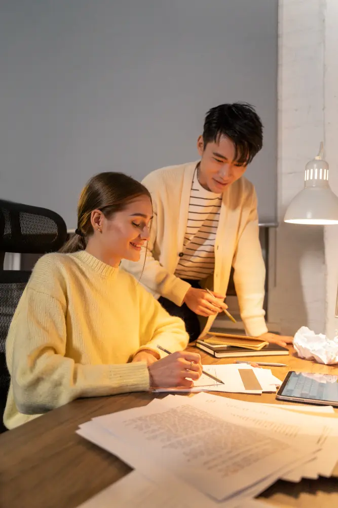 a boy and girl doing some digital marketing research work